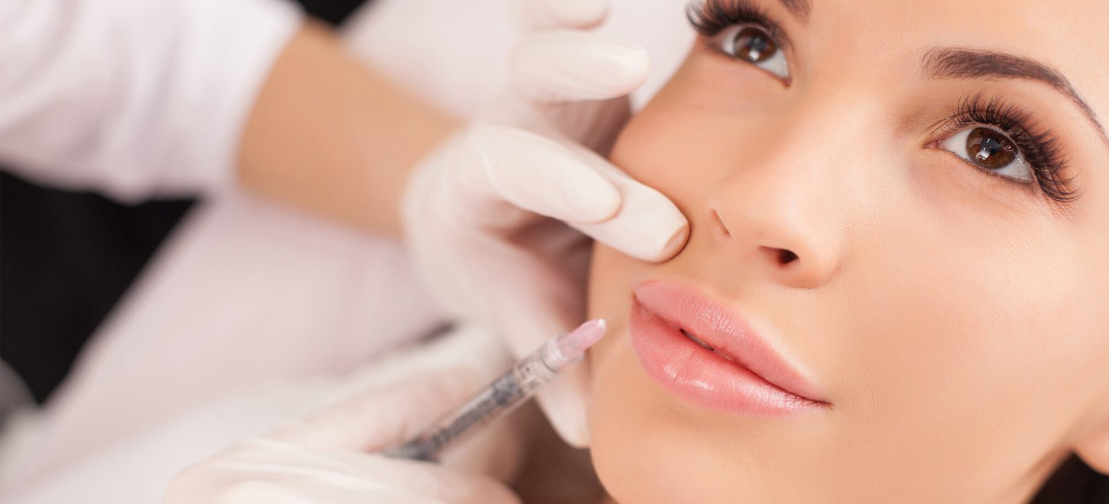 Practitioner preparing an assessment-led facial treatment